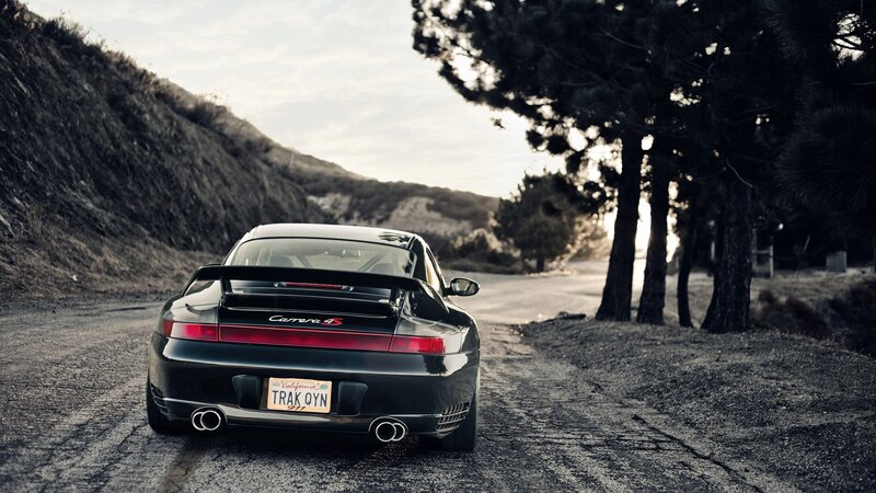 Black Porsche Carrera 4S — Dramatic, Sunset