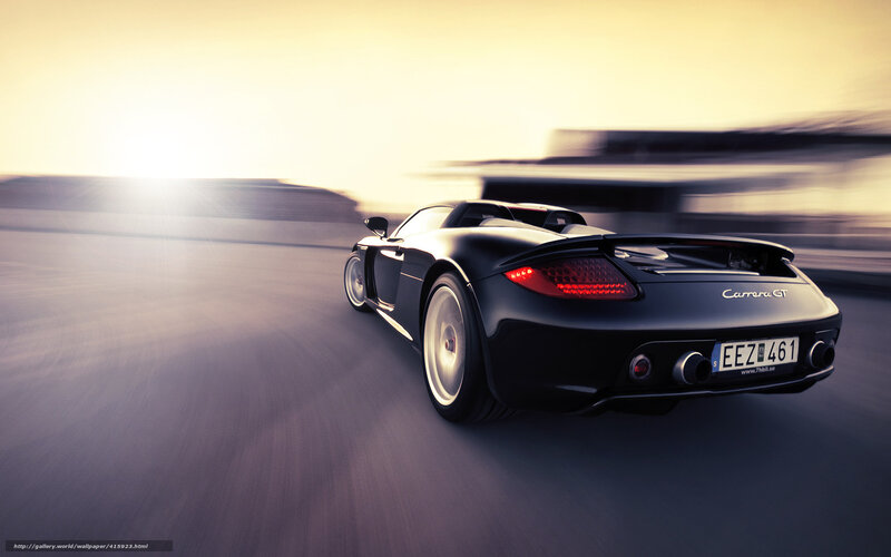 Black Porsche Carrera GT in motion