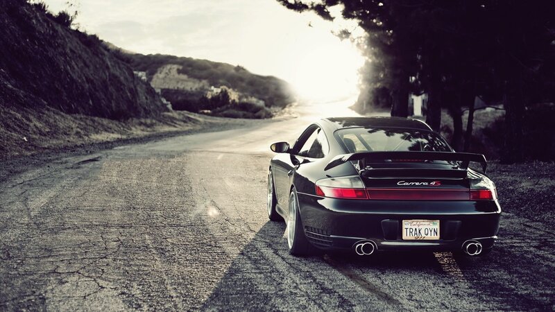 Black Porsche Carrera S — Dramatic, Sunset