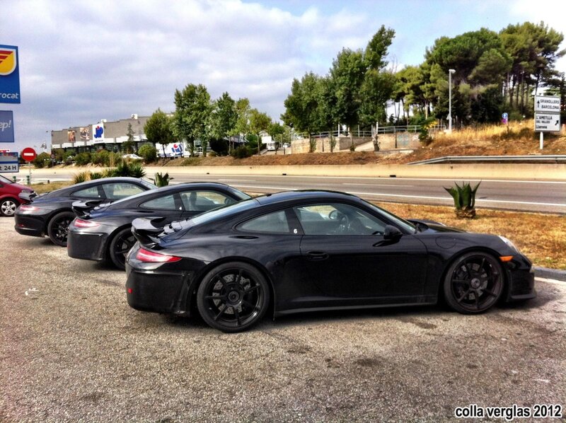 black porsche cars in a row