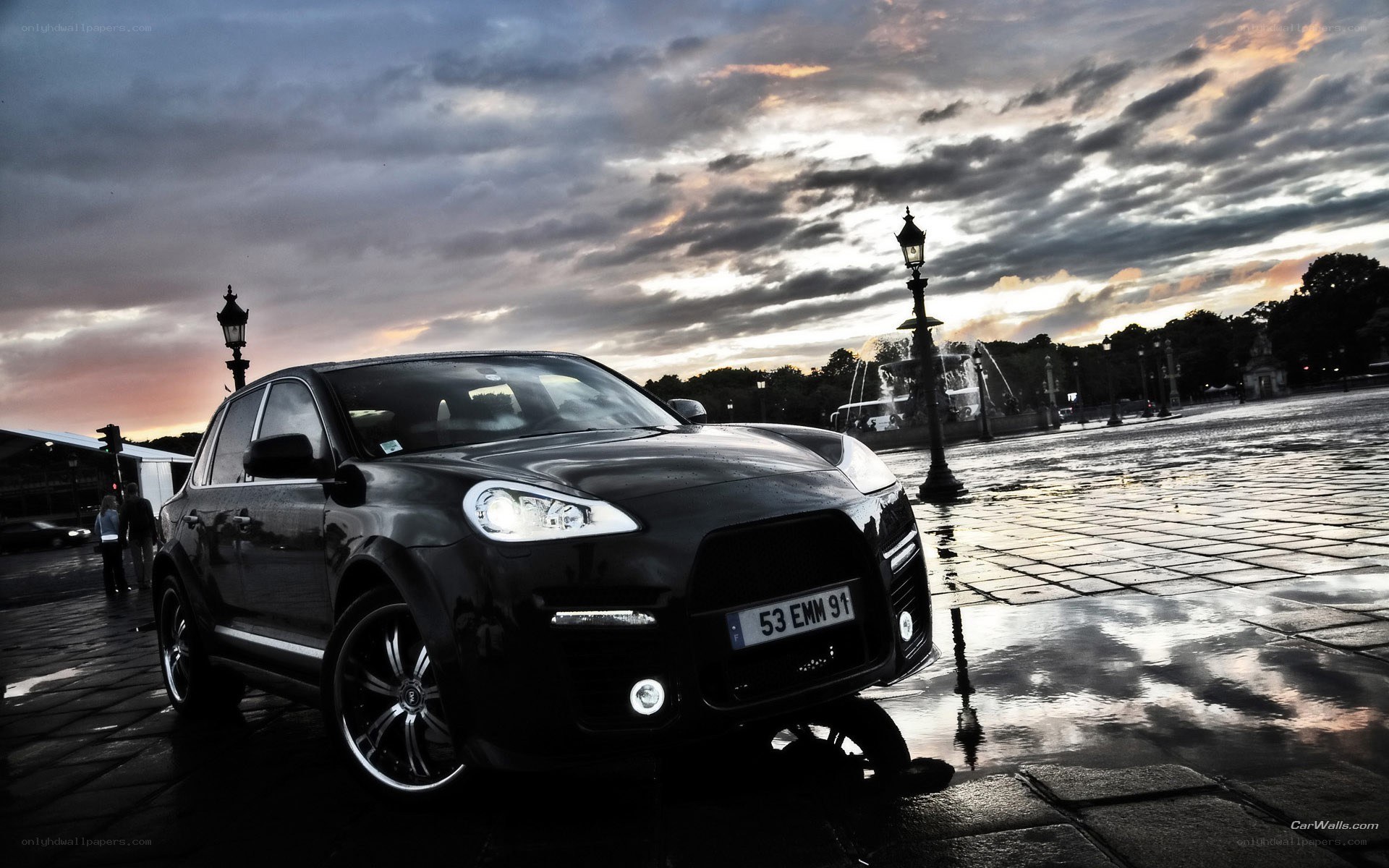 Black Porsche Cayenne at dusk