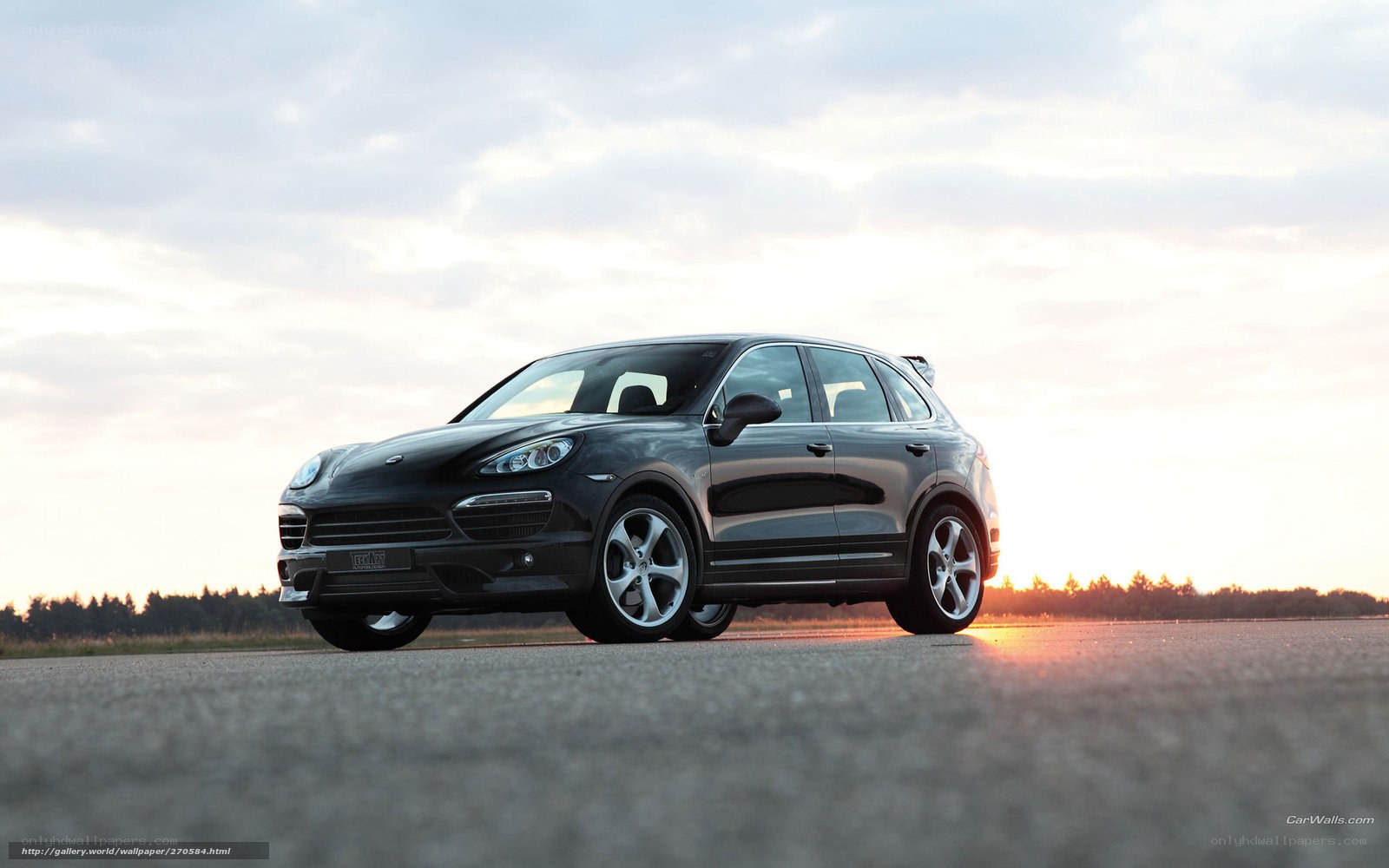 Black Porsche Cayenne at sunset