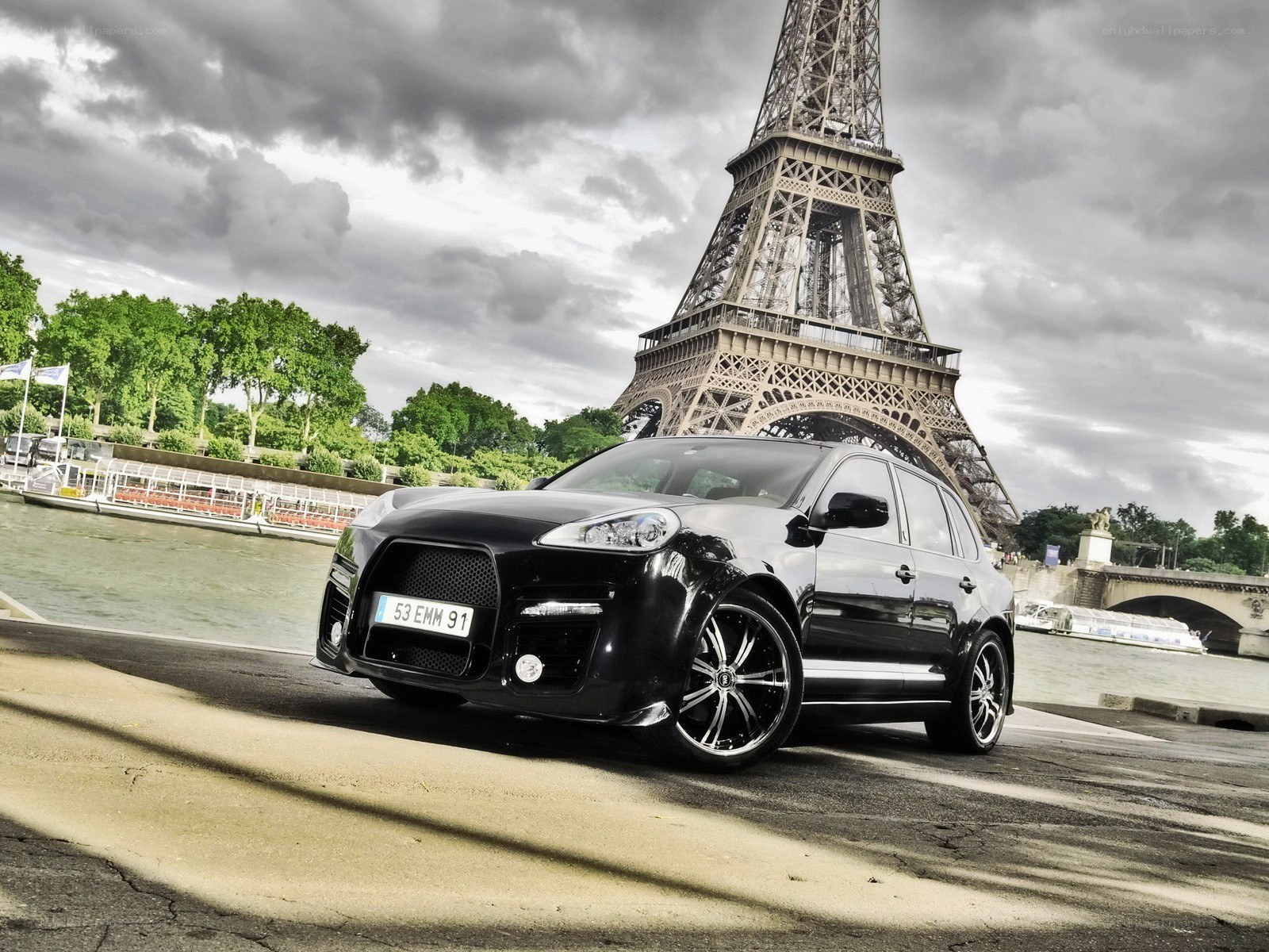 Black Porsche Cayenne by Eiffel Tower