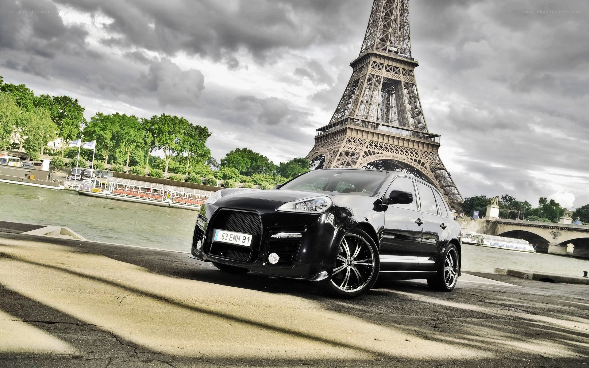 Black Porsche Cayenne by Eiffel Tower