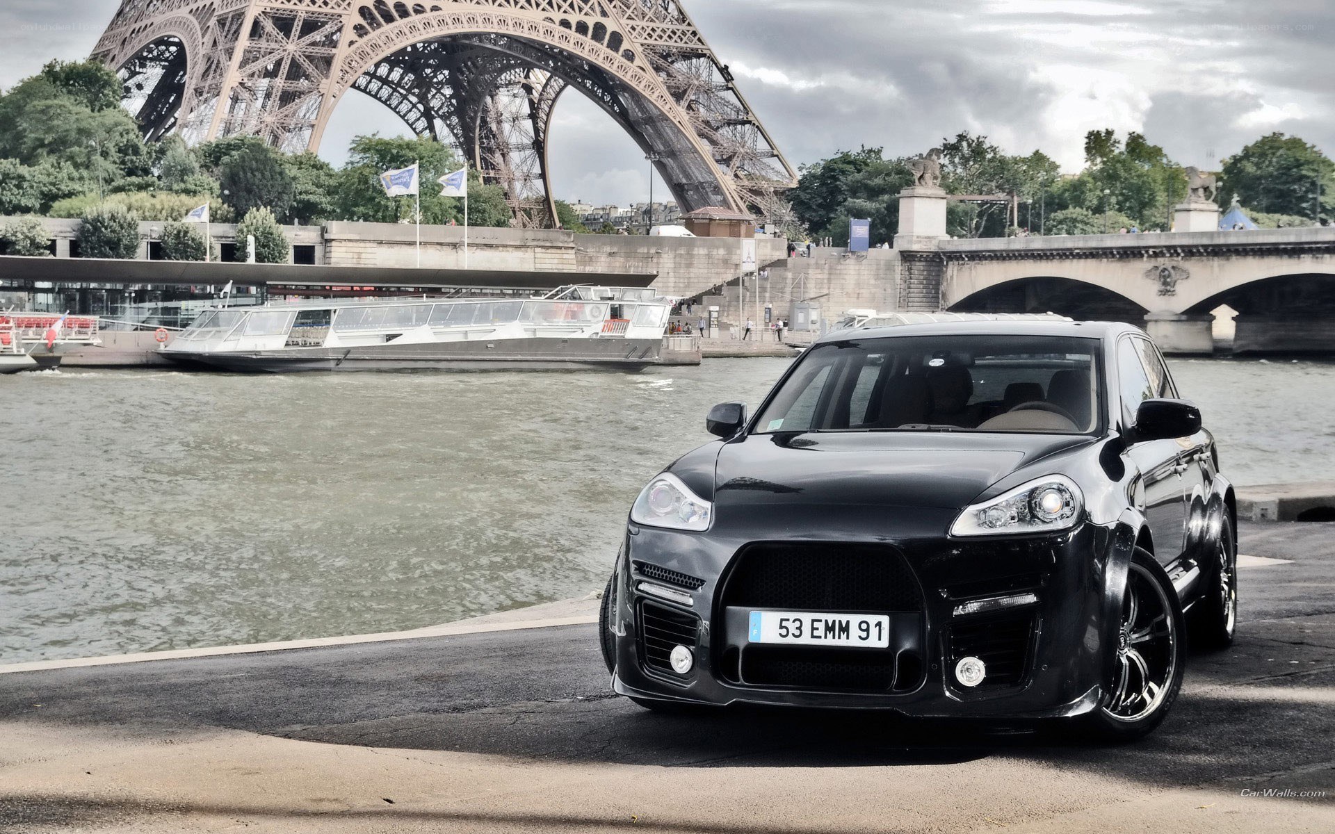 Black Porsche Cayenne by Eiffel Tower
