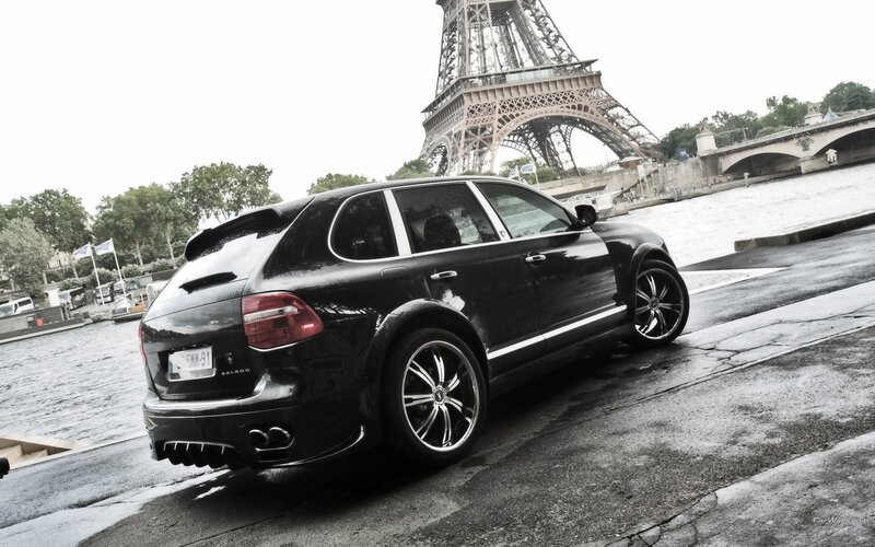 Black Porsche Cayenne by Eiffel Tower
