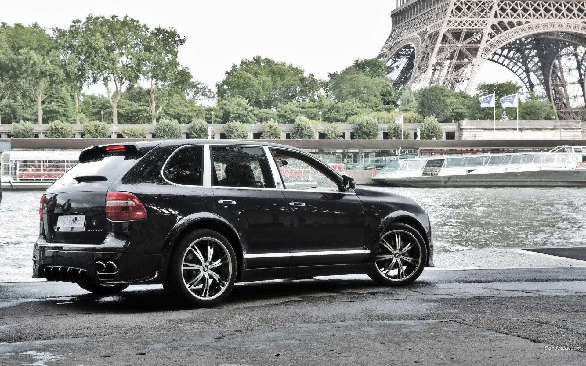 Black Porsche Cayenne by Eiffel Tower