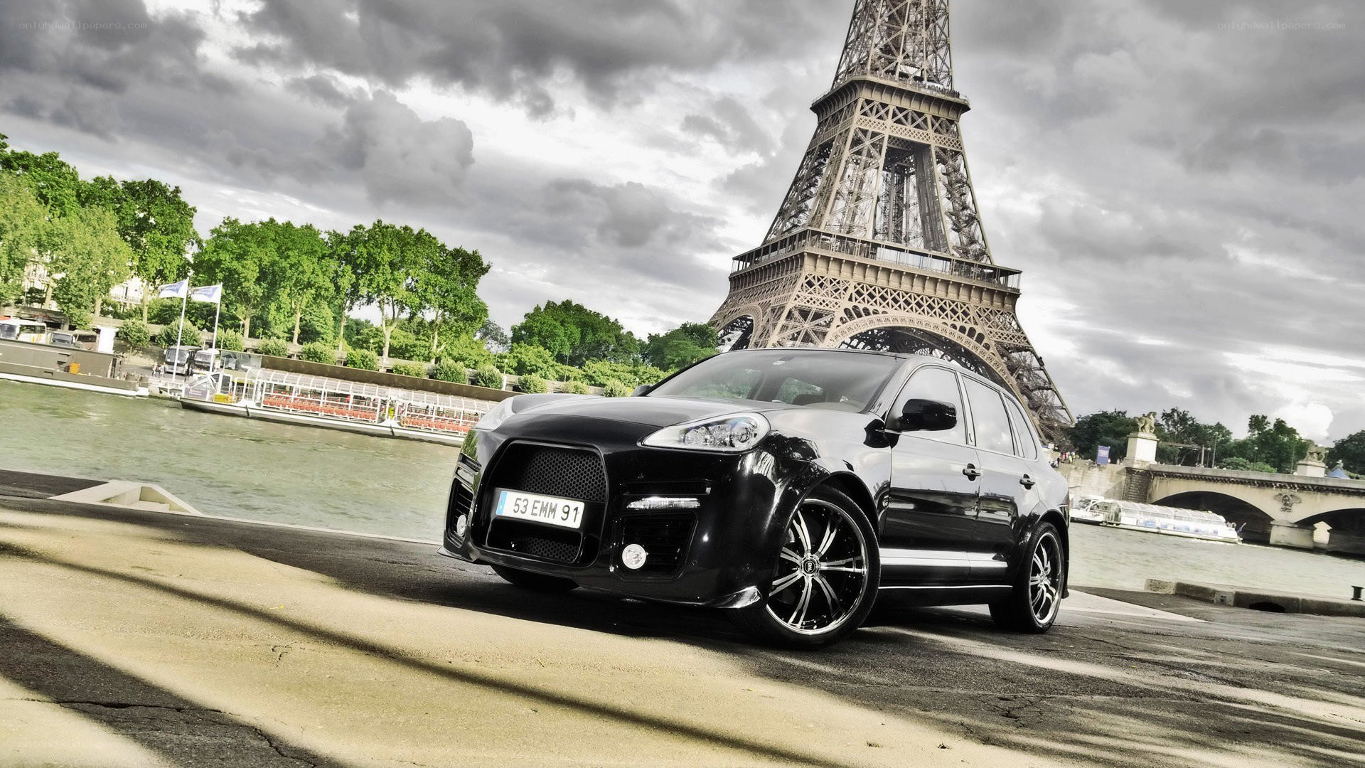 Black Porsche Cayenne by Eiffel Tower