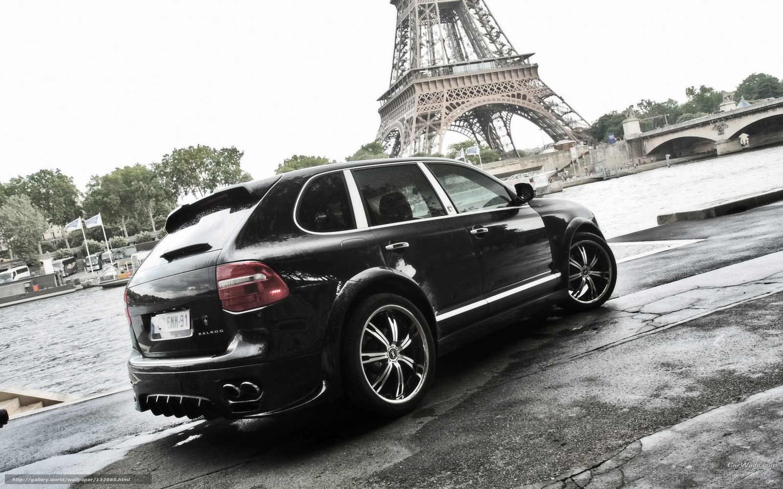 Black Porsche Cayenne by Eiffel Tower