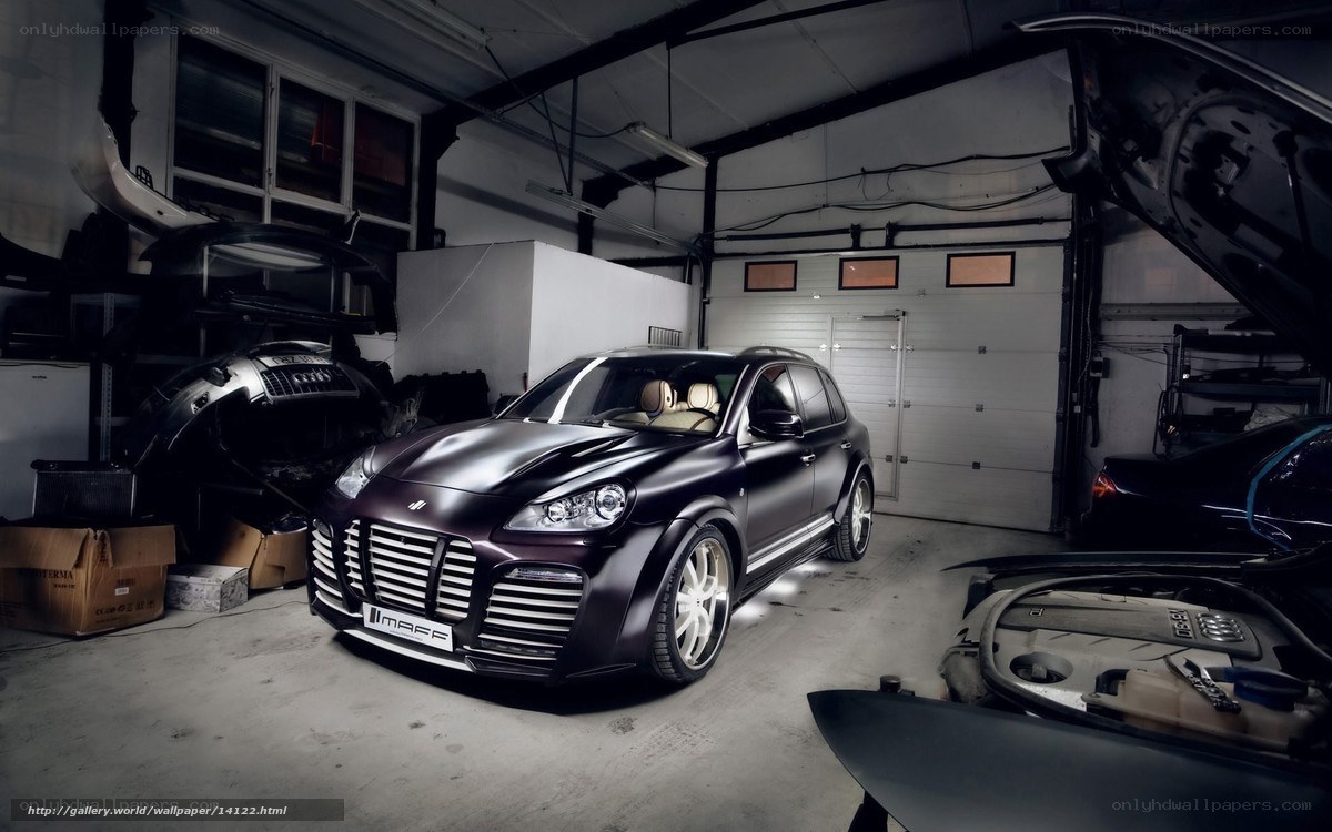 Black Porsche Cayenne in garage