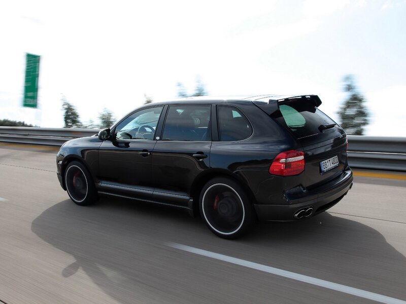 black porsche cayenne in motion