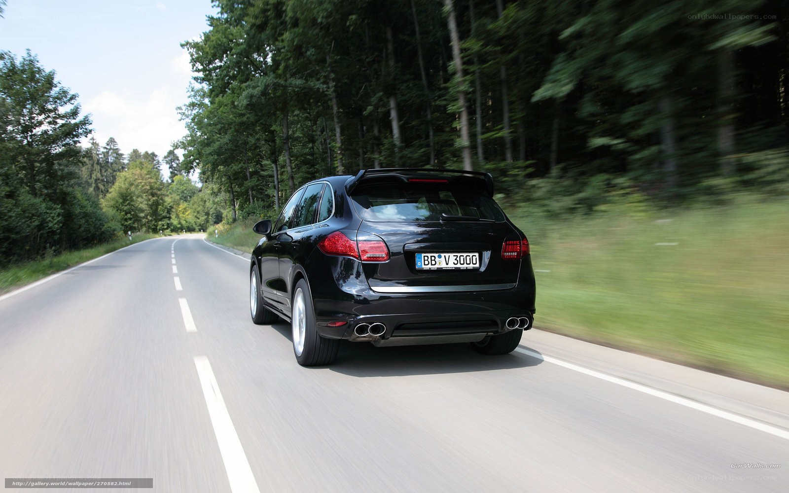 Black Porsche Cayenne in motion