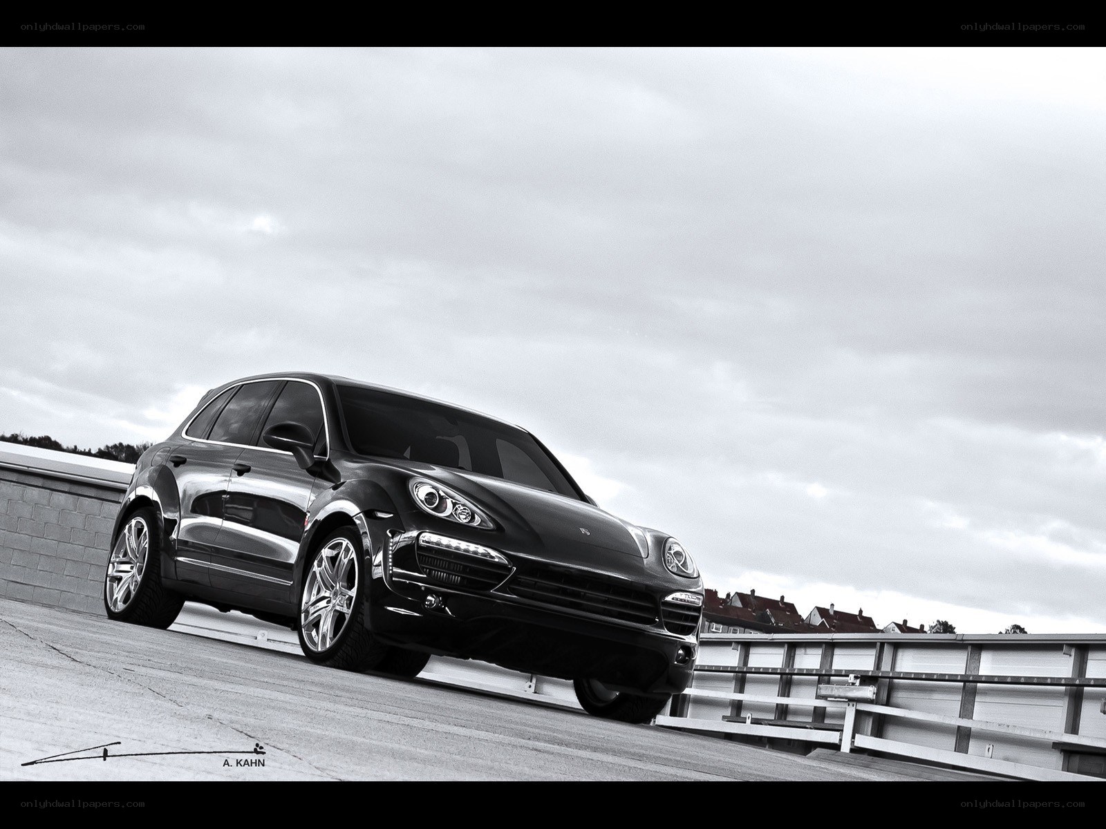 Black Porsche Cayenne on a bridge