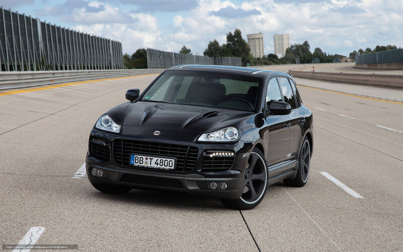 Black Porsche Cayenne on a racetrack
