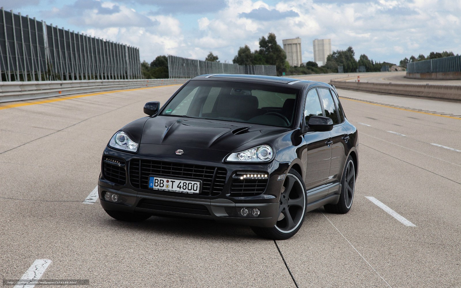 Black Porsche Cayenne on a racetrack
