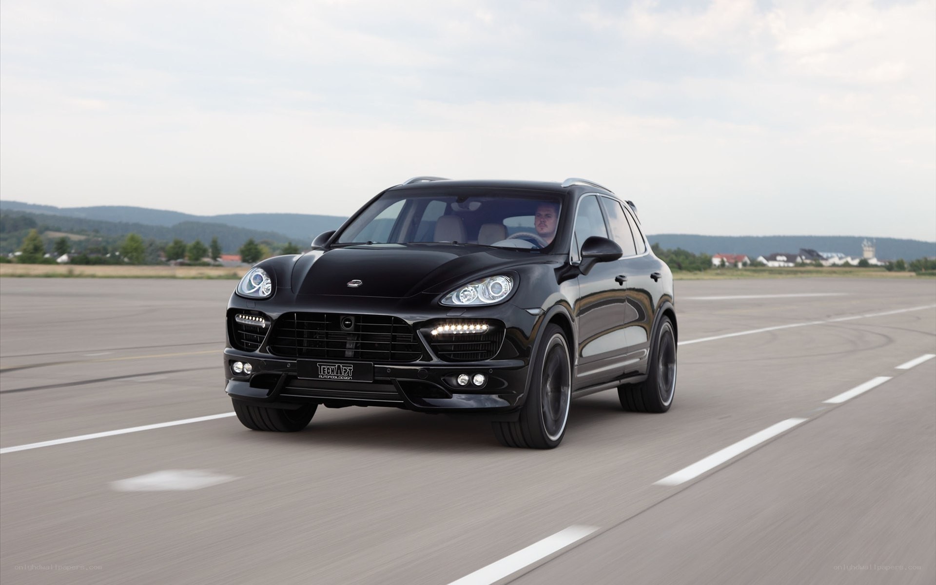Black Porsche Cayenne on a runway