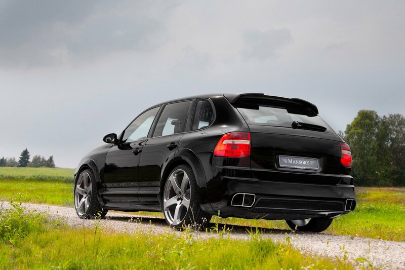 Black Porsche Cayenne on gravel road