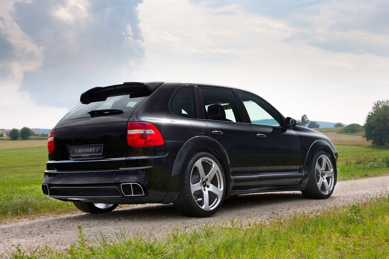 Black Porsche Cayenne on gravel road