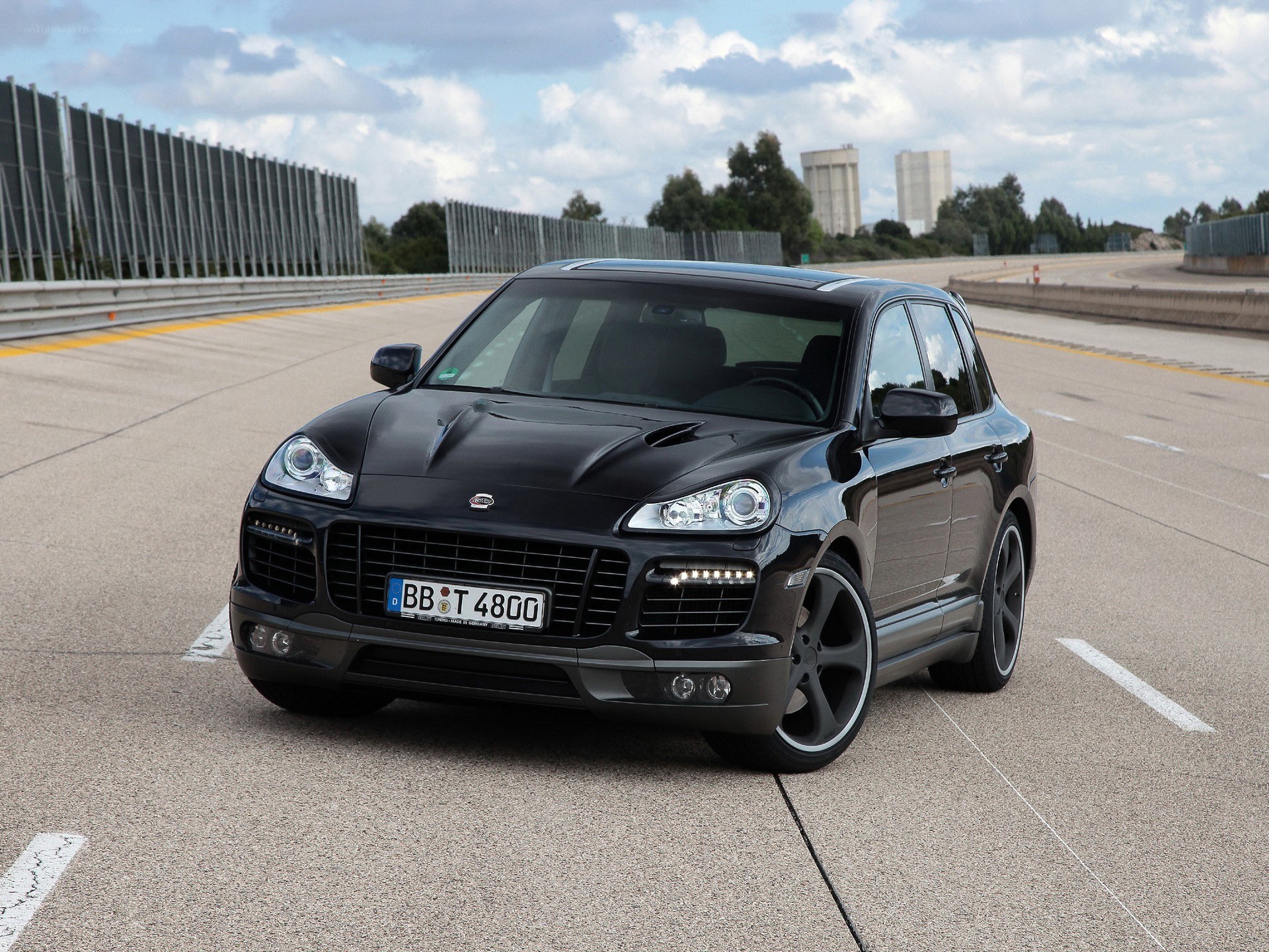 Black Porsche Cayenne on racetrack