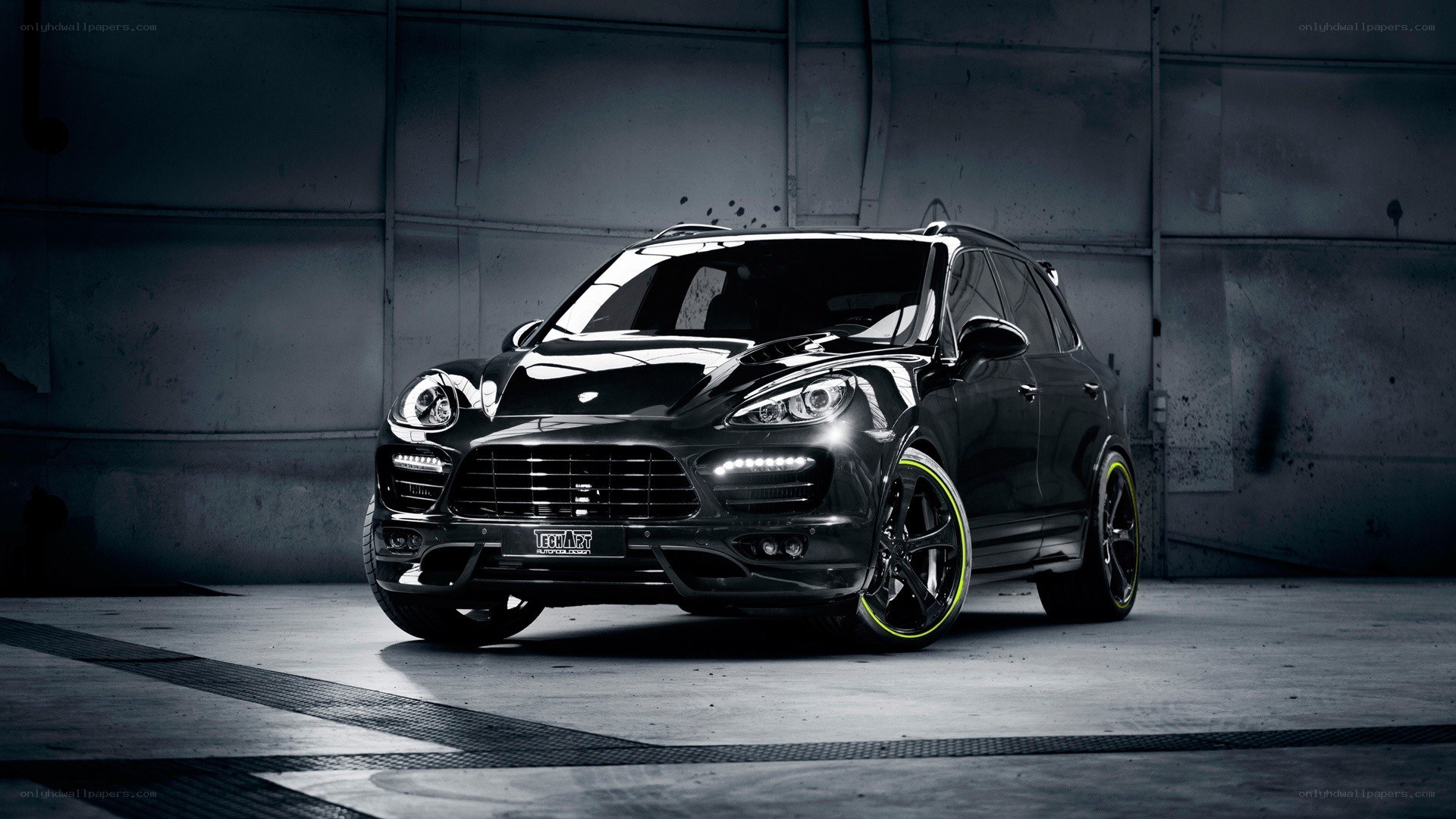 Black Porsche Cayenne with custom wheels