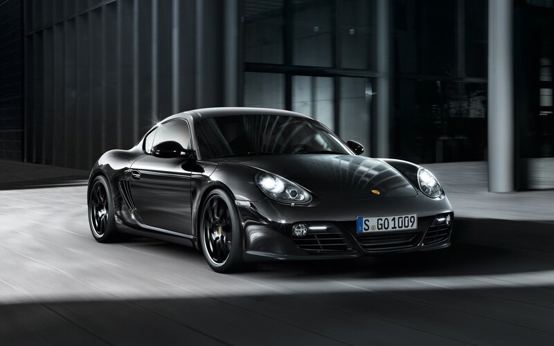 Black Porsche Cayman in modern setting