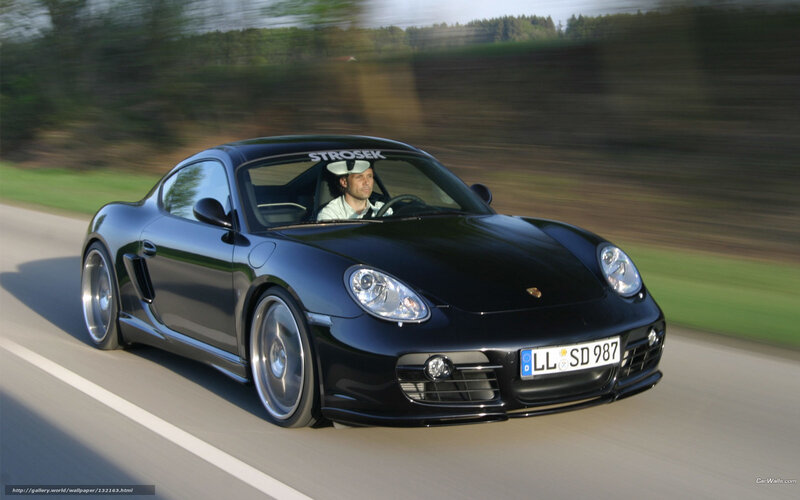 black porsche cayman in motion