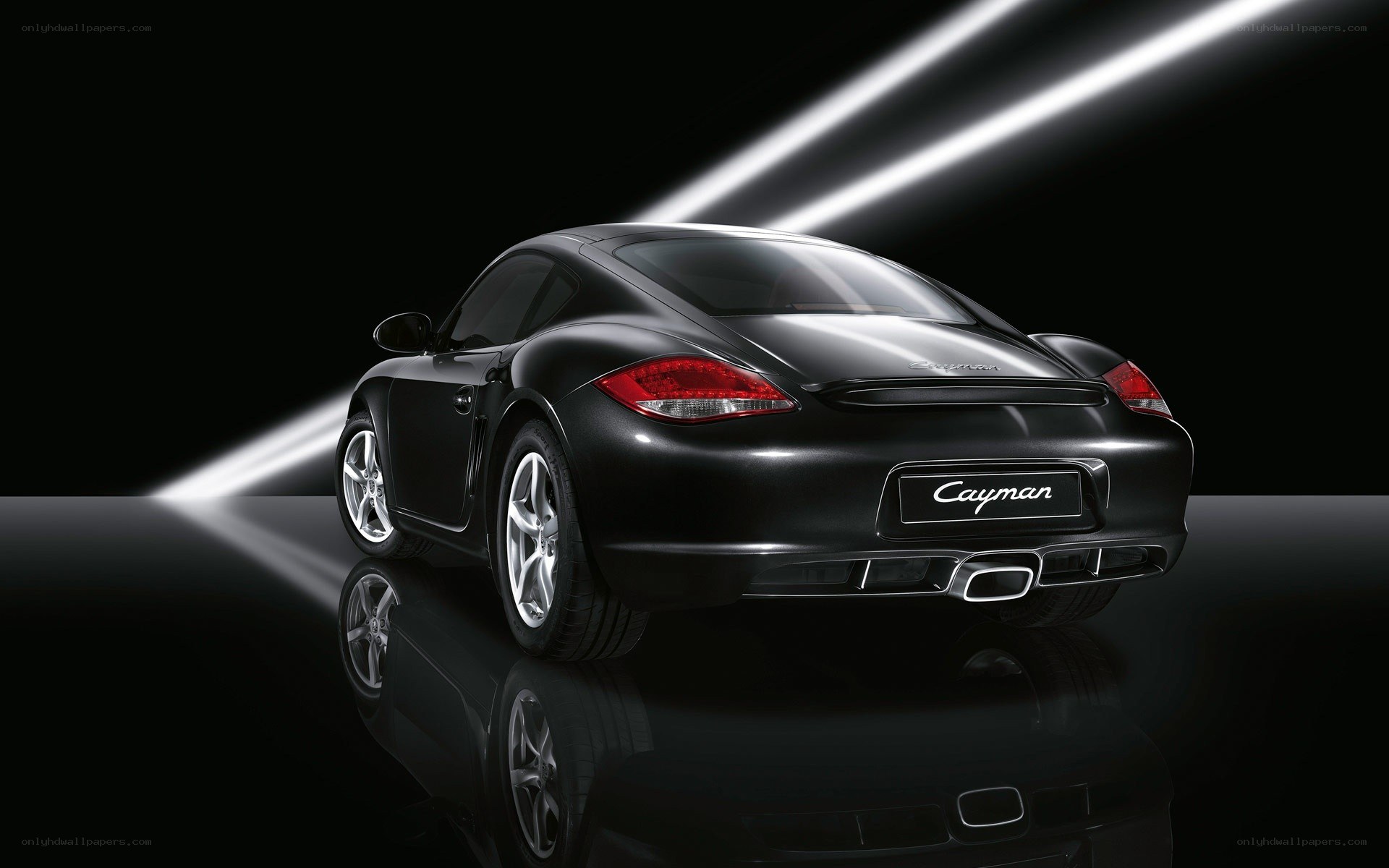 Black Porsche Cayman rear view