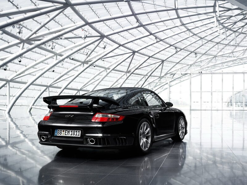 Black Porsche GT2 in modern hall