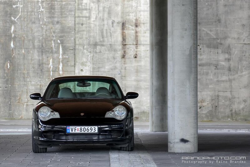 Black Porsche in concrete structure