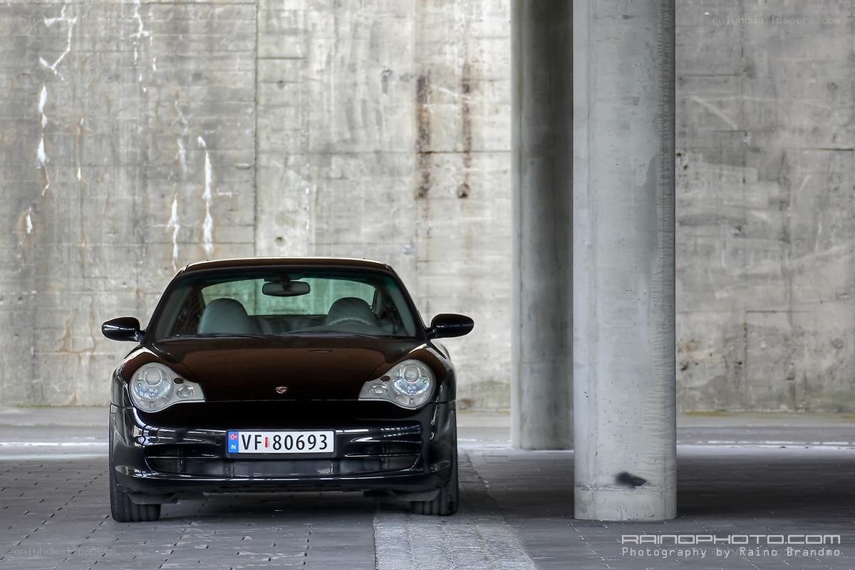 Black Porsche in concrete structure
