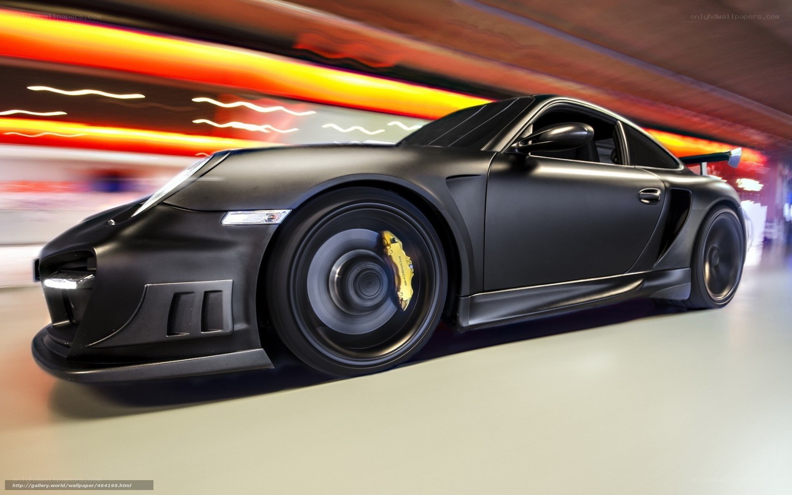 Black Porsche in motion