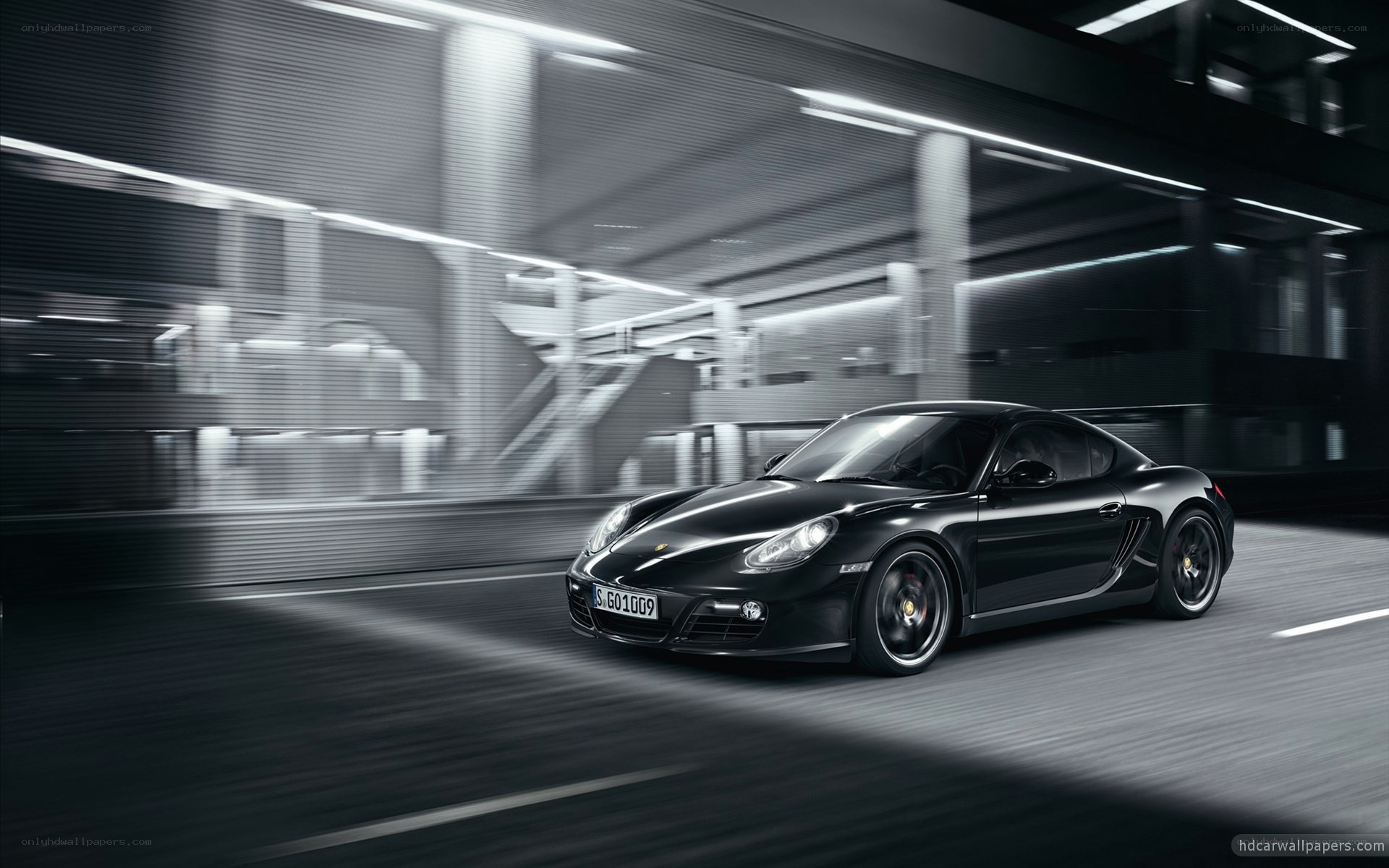 Black Porsche in motion