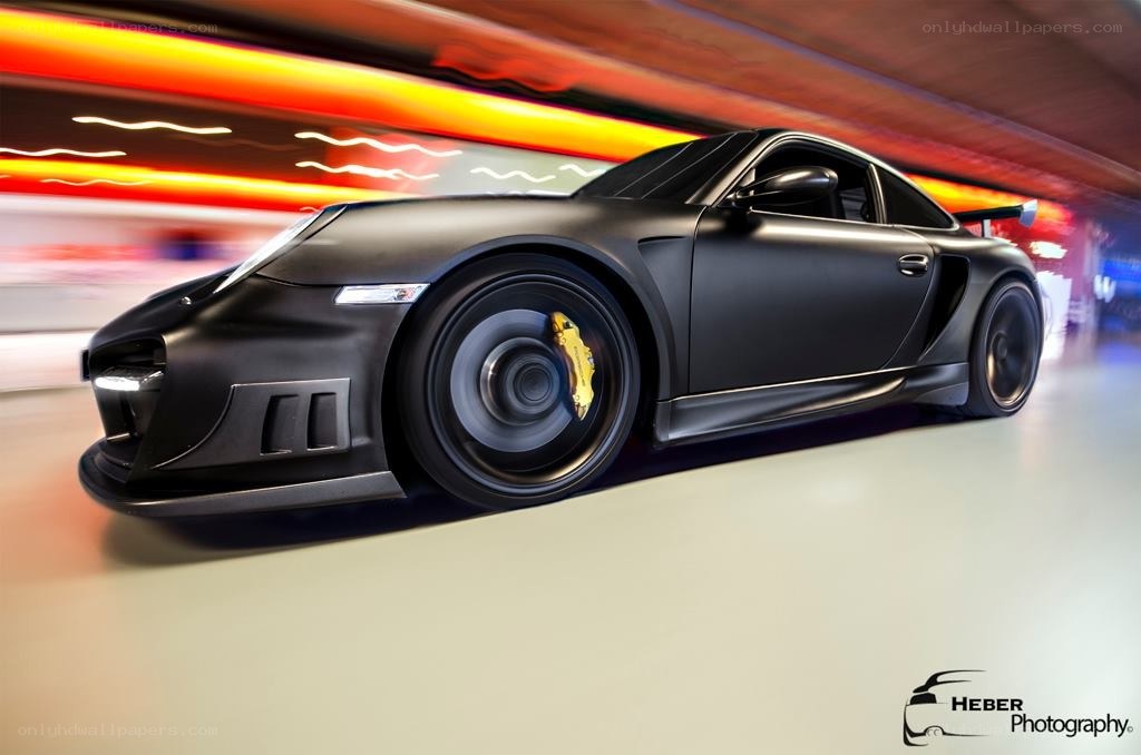 Black Porsche in motion