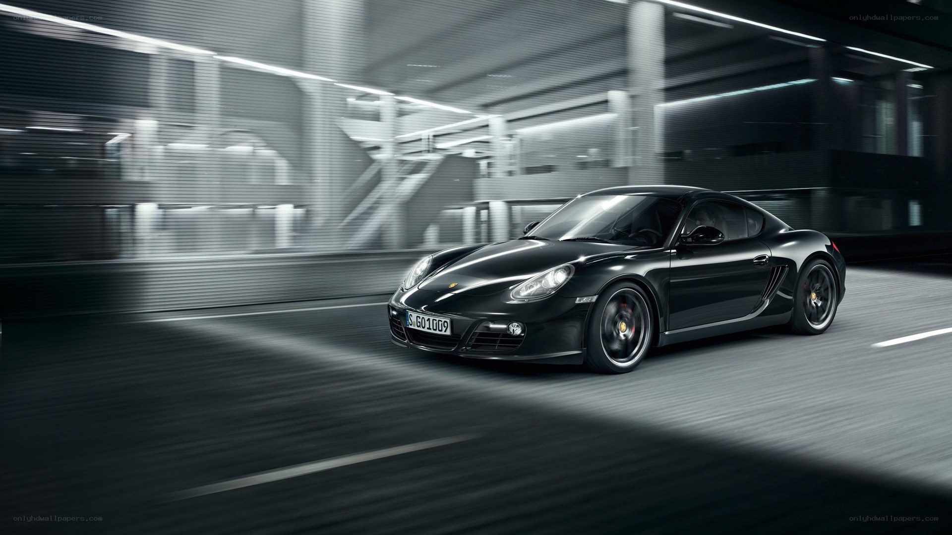 Black Porsche in motion