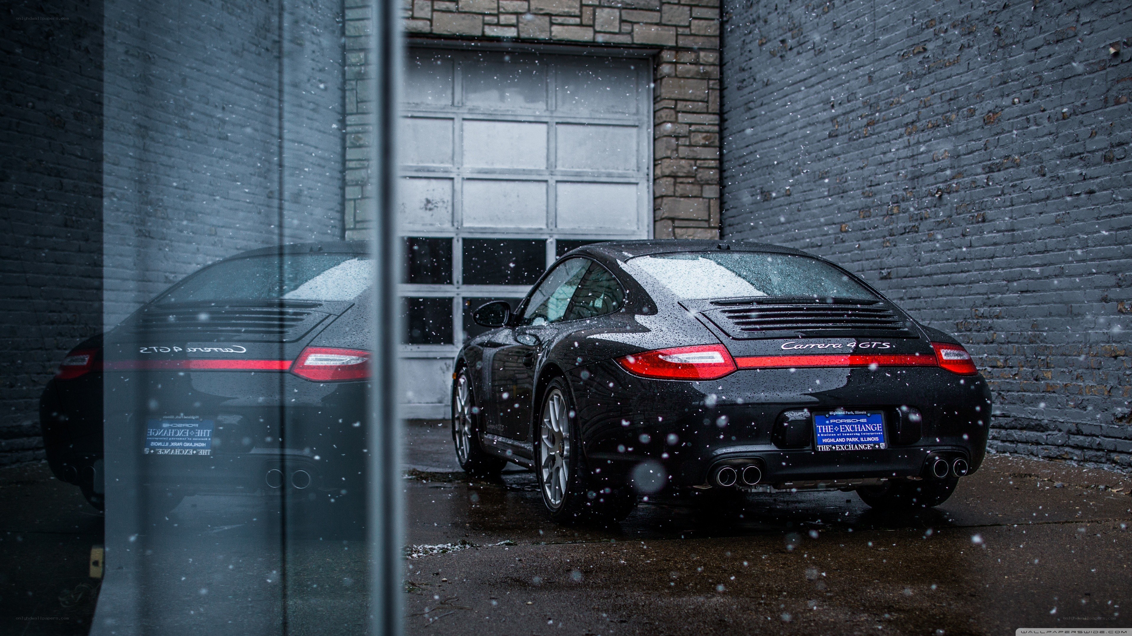 Black Porsche in snow