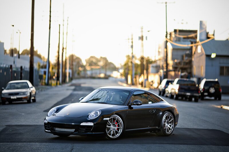Black Porsche on a city street