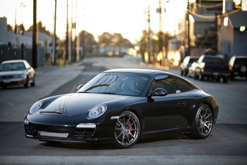 Black Porsche on a city street