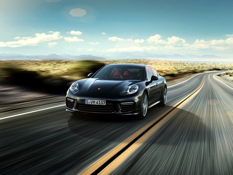 Black Porsche on a desert road