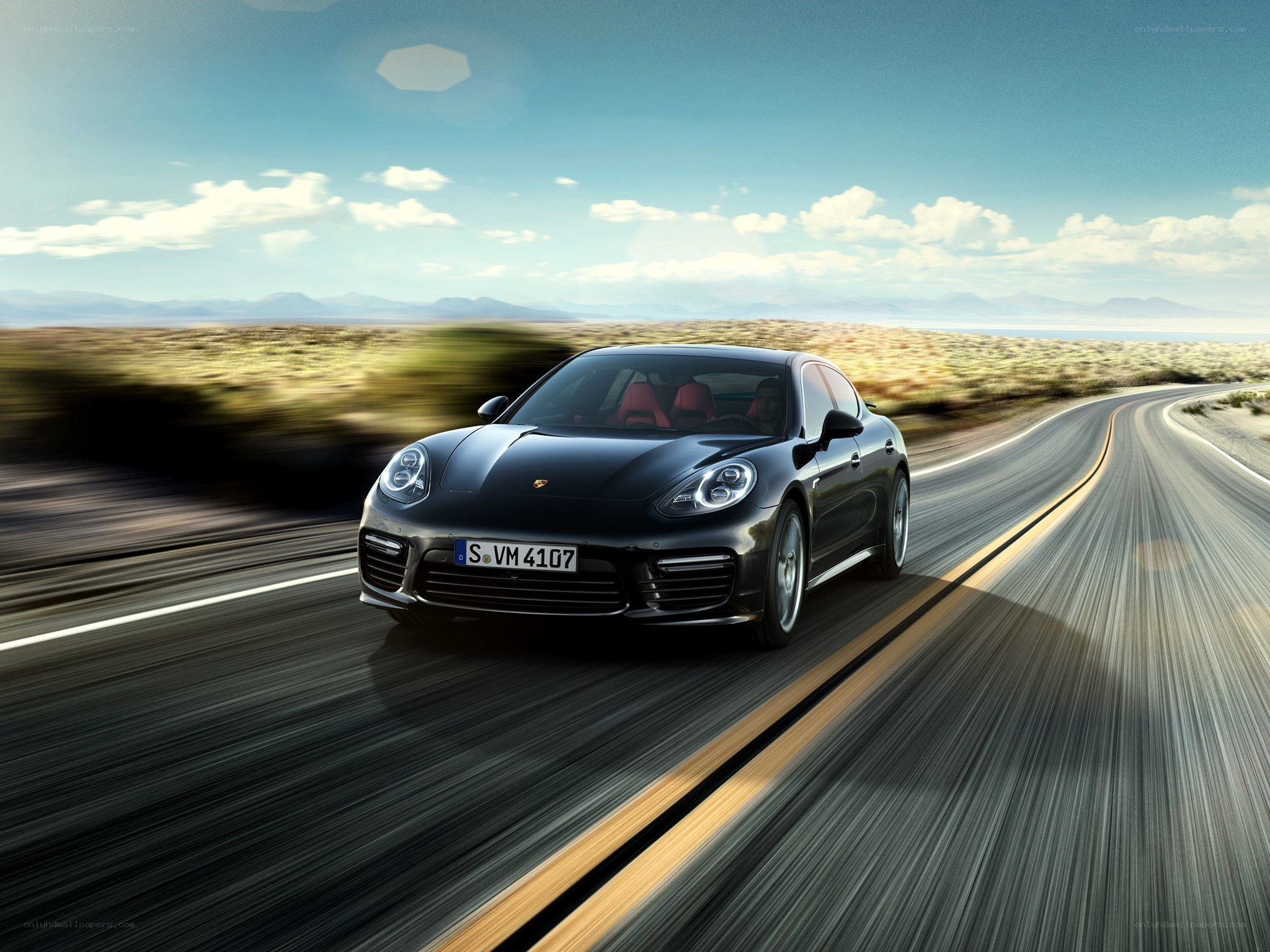 Black Porsche on a desert road