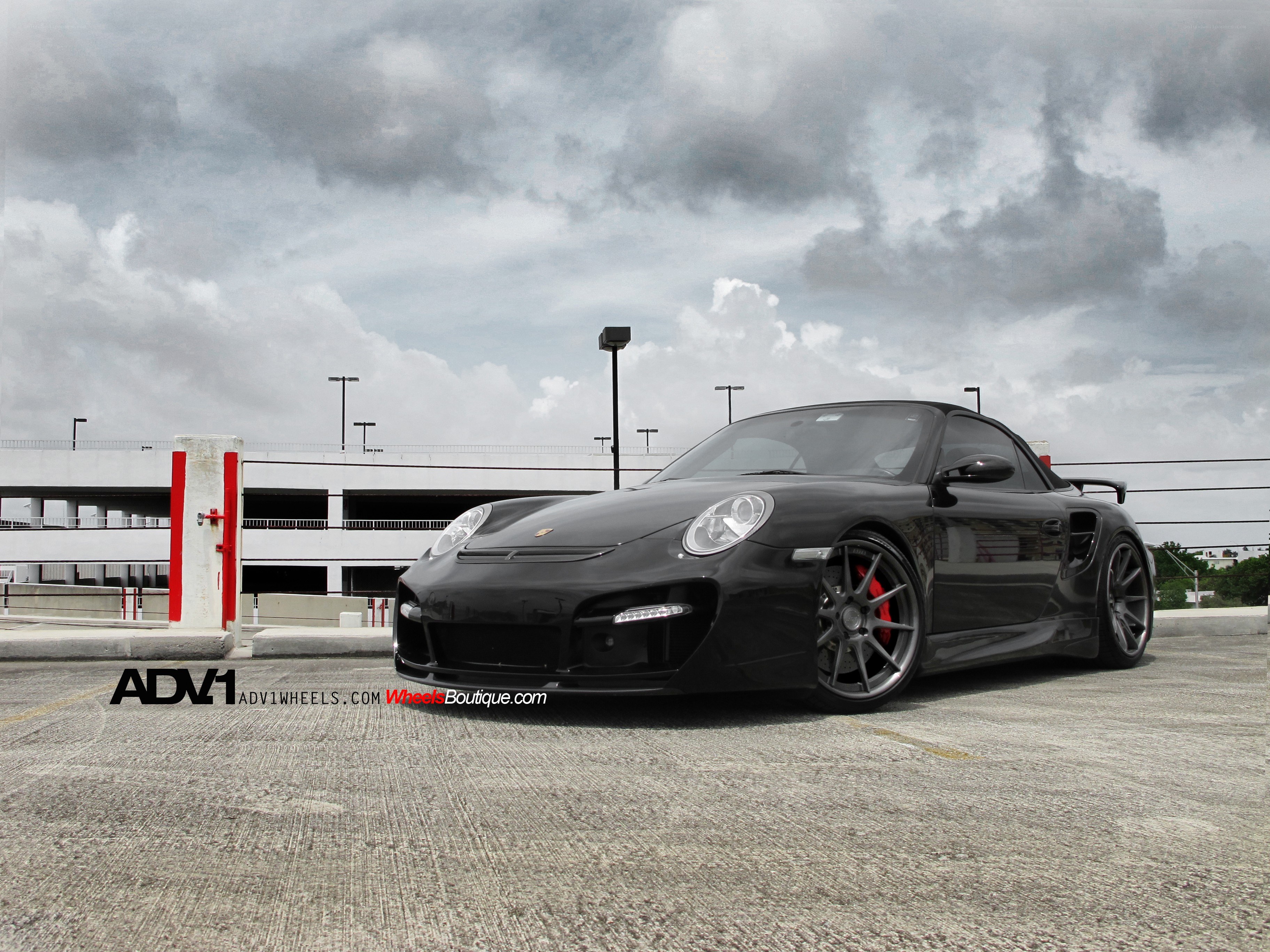 Black Porsche on a parking deck