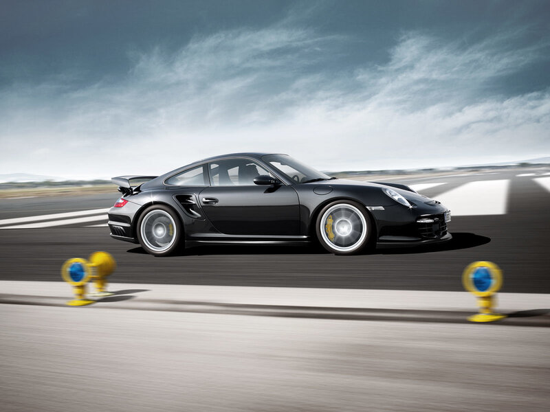 Black Porsche on a racetrack