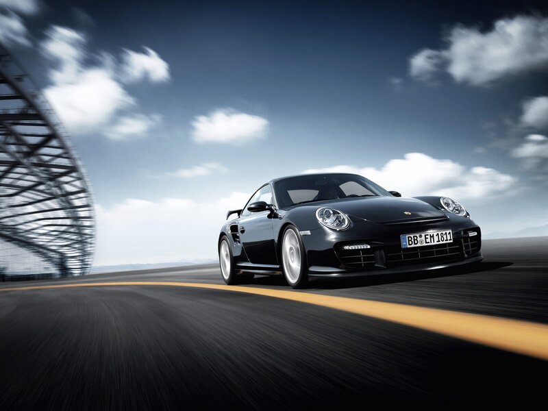 Black Porsche on a racetrack