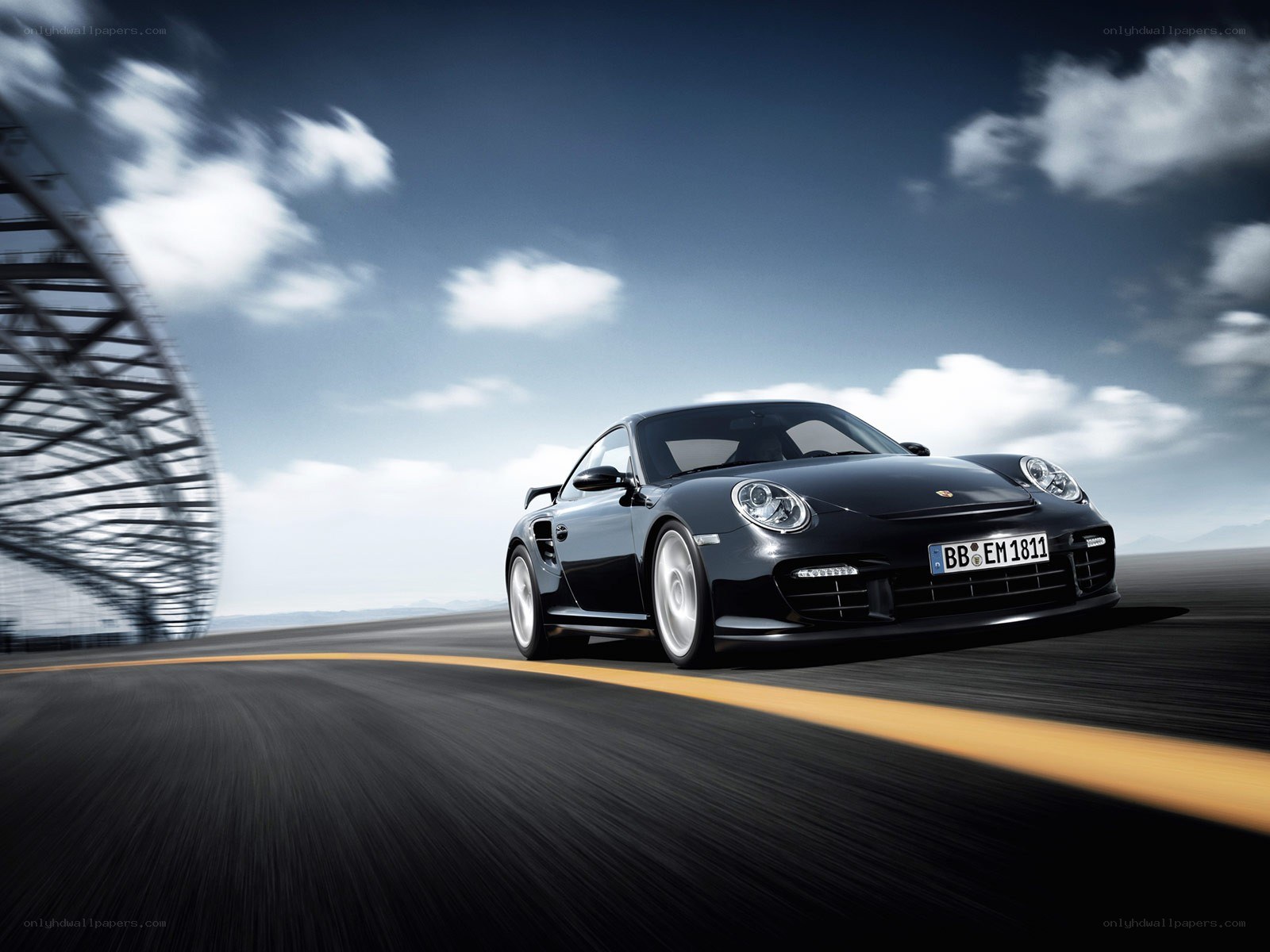 Black Porsche on a racetrack