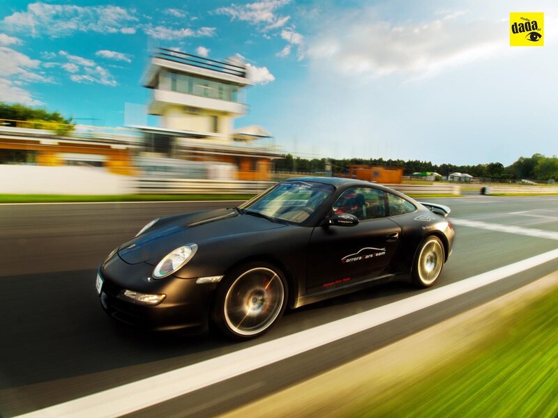 Black Porsche on a racetrack
