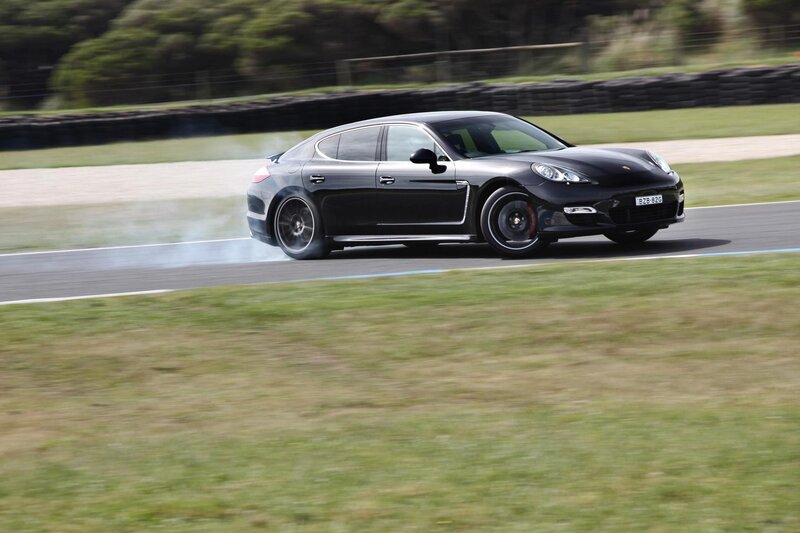 Black Porsche on a racetrack