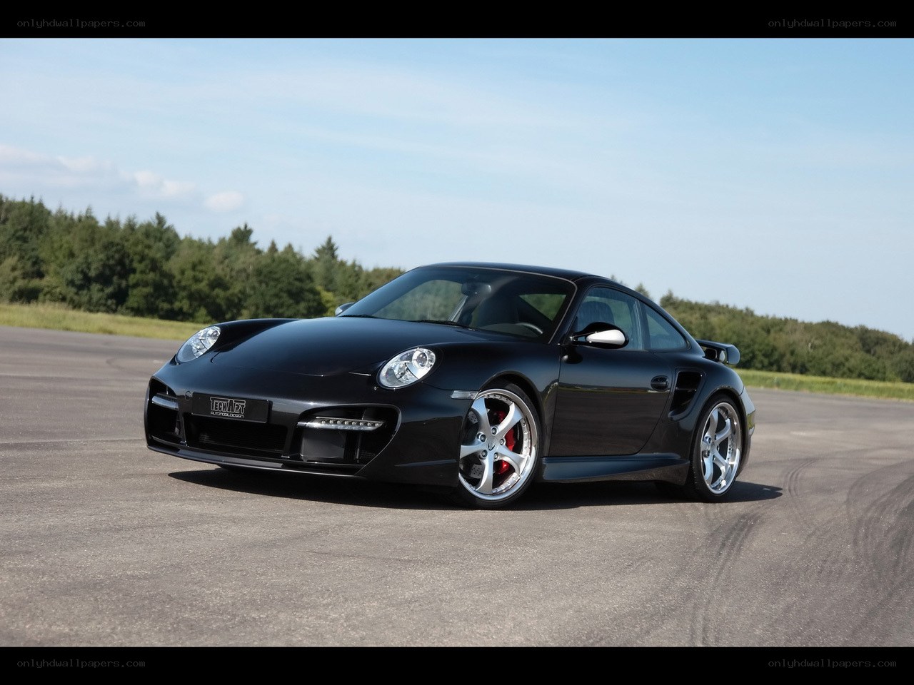 Black Porsche on a racetrack