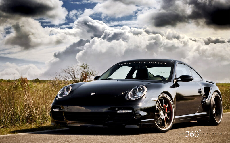 Black Porsche on a road
