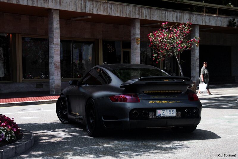 Black Porsche on city street