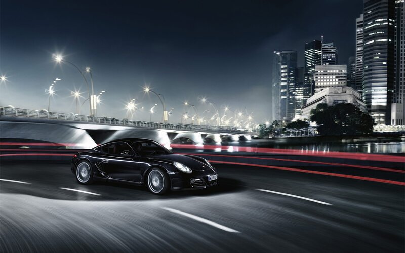 Black Porsche on city street