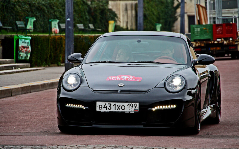 Black Porsche on city street